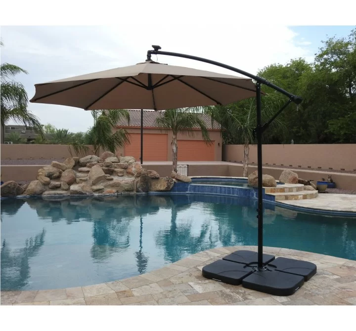 AZ Patio Heaters Offset Cantilever Umbrella with LED Lights in Tan with Cantilever Umbrella Base Set - Lifestyle