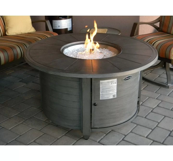 AZ Patio Heaters Cast Aluminum Round Fire Pit in Brushed Wood Finish - Lifestyle