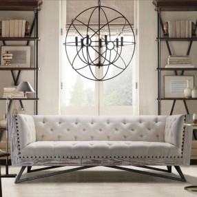 Armen Living Regis Sofa in Cream Fabric with Black Metal Finish Legs and Antique Brown Nailhead Accents