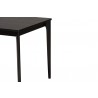 Baxton Studio Sherwin Mid-Century Modern Black Finished Wood Dining Table - Front Side Closeup Top Angle