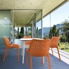 Air Maya Square Dining Set with White Table and 4 Orange Chairs - Lifestyle