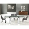 ASTOR Dining Table In Clear Glass With Polished Stainless Steel Base - Lifestyle